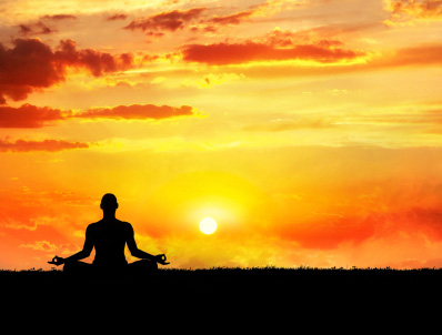 Yoga meditation at sunset